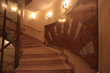 Staircase at the dress-circle level. Fragment of old masonry.Photo by Damir Yusupov